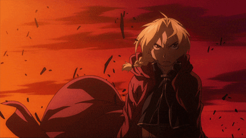 A Man In A Red Cape Stands In Front Of A Red And Orange Background GIF