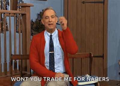 A Man In A Red Cardigan And Tie Is Sitting On A Bench And Says " Wont You Trade Me For Nabers " GIF