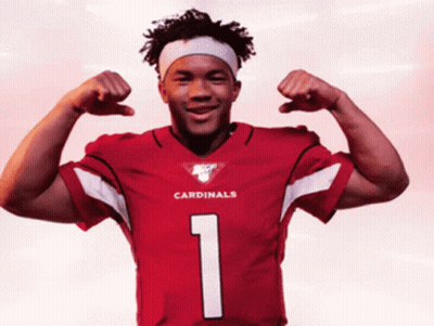 A Man In A Red Cardinals Jersey Flexes His Arms GIF
