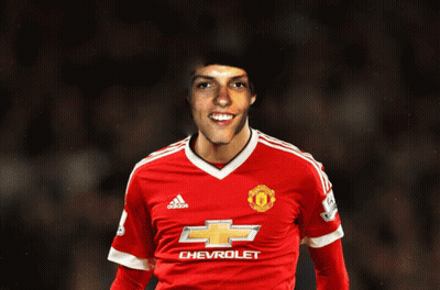 A Man In A Red Chevrolet Jersey Smiles GIF