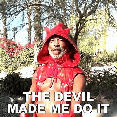 A Man In A Red Devil Costume With The Words The Devil Made Me Do It Below Him GIF