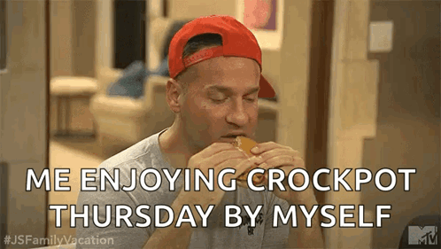 A Man In A Red Hat Is Eating A Hamburger On Thursday By Himself . GIF