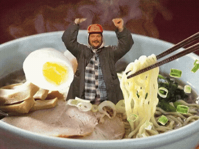 A Man In A Red Hat Is Standing In A Bowl Of Noodles GIF