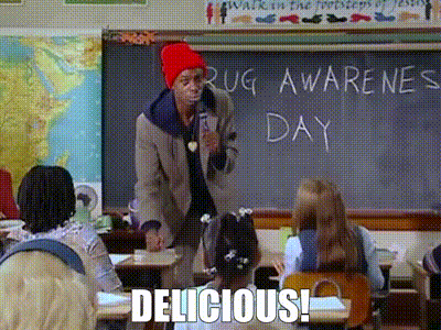 A Man In A Red Hat Is Standing In Front Of A Blackboard With The Words Drug Awareness Day Written On It GIF