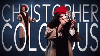 A Man In A Red Hat Is Standing In Front Of A Blue Background That Says Christopher Columbus GIF