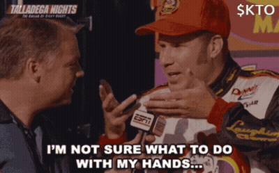 A Man In A Red Hat Is Talking To Another Man While Holding A Espn Microphone GIF