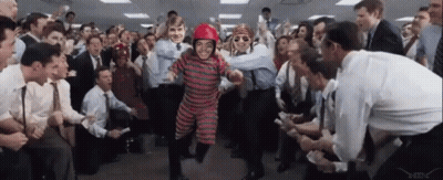A Man In A Red Helmet Is Surrounded By People GIF