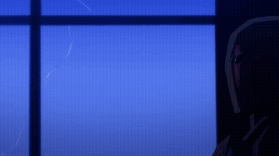 A Man In A Red Helmet Looks Out A Window At Night GIF