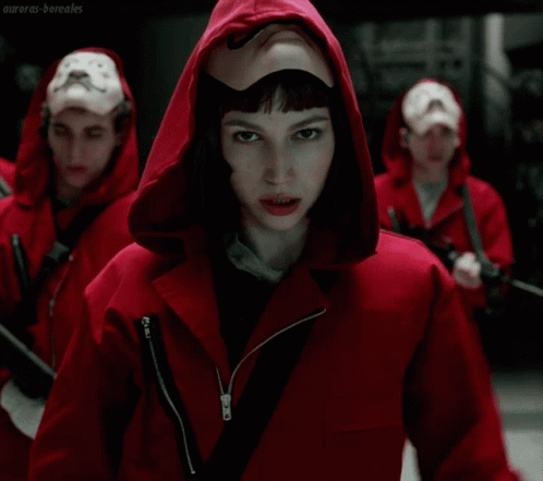 A Man In A Red Hooded Jacket Has A Mustache On His Face And A White Glove On His Hand GIF