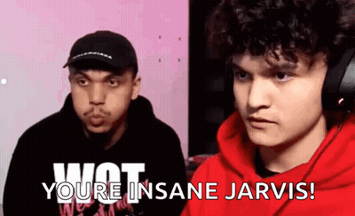 A Man In A Red Hoodie Is Talking To Another Man In A Black Hat While Wearing Headphones . GIF