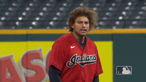 A Man In A Red Indians Jersey Is Running On The Field GIF