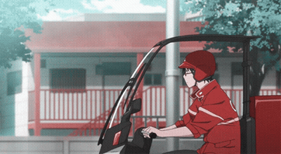 A Man In A Red Jacket And Helmet Is Driving A Red Vehicle GIF
