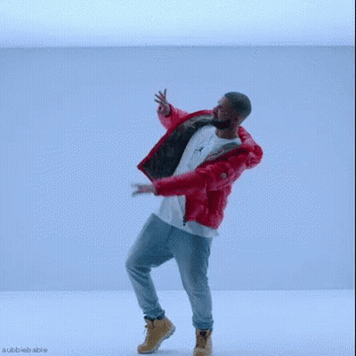 A Man In A Red Jacket And Jeans Is Dancing In A Blue Room . GIF