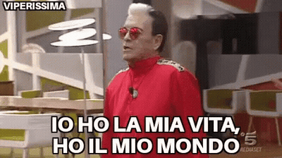 A Man In A Red Jacket And Sunglasses Says Io Ho La Mia Vita Ho Il Mio Mondo . GIF