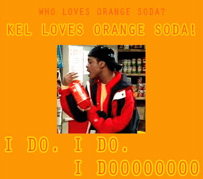 A Man In A Red Jacket Drinking Orange Soda GIF