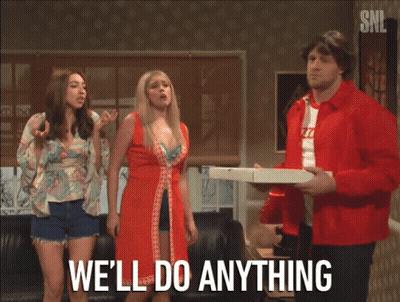 A Man In A Red Jacket Holding A Pizza Box Says We 'Ll Do Anything In Front Of Two Women GIF