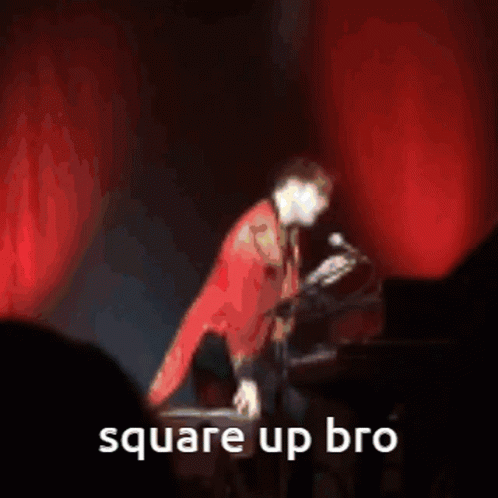 A Man In A Red Jacket Is Dancing With The Words Square Up Bro Written Below Him GIF