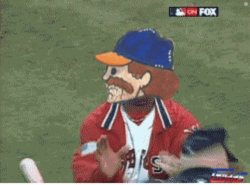 A Man In A Red Jacket Is Hugging Another Man With The Letter X On The Bottom Right GIF