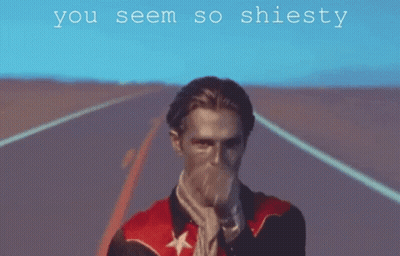 A Man In A Red Jacket Is Pointing At The Camera With The Words " You Seem So Shiesty " Below Him GIF