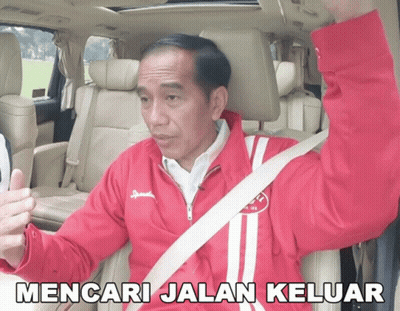 A Man In A Red Jacket Is Sitting In A Car With The Words Mencari Jalan Keluar Written Below Him GIF