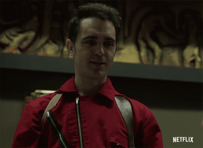 A Man In A Red Jacket Is Smiling With A Netflix Logo In The Corner GIF