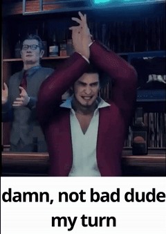 A Man In A Red Jacket Is Standing In Front Of A Man In A Suit . GIF