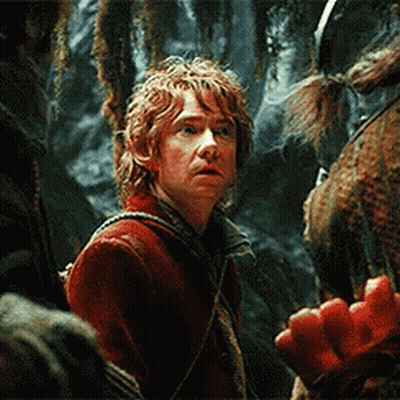 A Man In A Red Jacket Is Standing Next To A Horse In A Forest . GIF