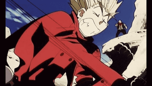 A Man In A Red Jacket Is Standing On Top Of A Snowy Hill GIF
