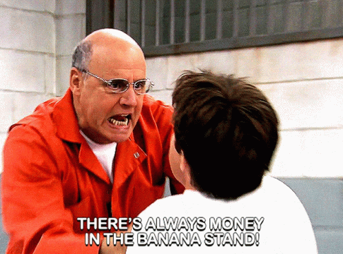 A Man In A Red Jacket Is Talking To Another Man With The Words " There 'S Always Money In The Banana Stand " Above Him GIF