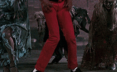 A Man In A Red Jacket Says Aaow In Front Of A Group Of Zombies GIF
