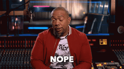 A Man In A Red Jacket Says Nope In Front Of A Sound Board GIF