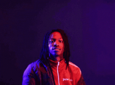 A Man In A Red Jacket Stands In Front Of A Sign That Says The More You Know GIF
