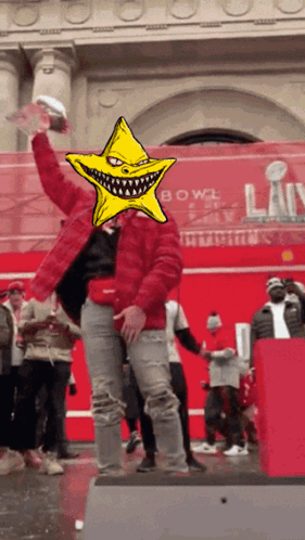 A Man In A Red Jacket With A Yellow Star In Front Of His Face GIF