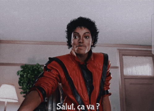 A Man In A Red Jacket With Salut Ca Va Written On The Bottom GIF