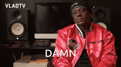 A Man In A Red Jacket With The Word Damn Written On It GIF