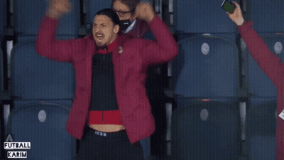 A Man In A Red Jacket With The Word Icon On The Bottom GIF