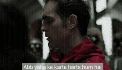 A Man In A Red Jacket With The Words Abb Yaha Ke Karta Harta Hum Hai Above Him GIF