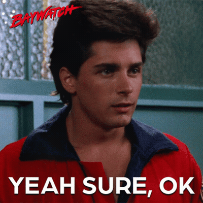 A Man In A Red Jacket With The Words Yeah Sure Ok Below Him GIF