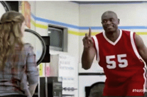 A Man In A Red Jersey With 55 On It GIF