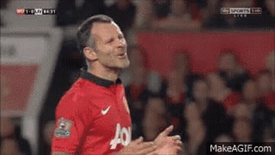 A Man In A Red Jersey With The Letter J On It Is Clapping GIF
