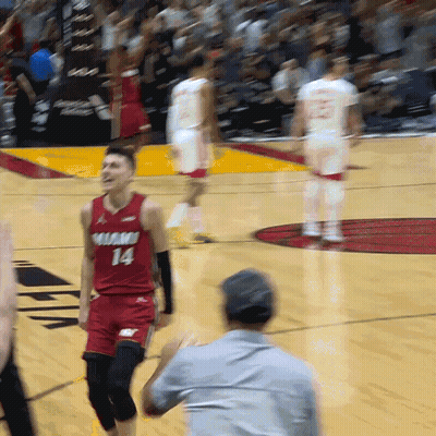 A Man In A Red Jersey With The Number 14 On The Front GIF