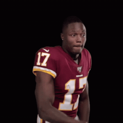 A Man In A Red Jersey With The Number 17 On It Is Making A Funny Face . GIF