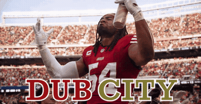 A Man In A Red Jersey With The Number 54 On It Holds Up A Cup GIF