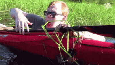 A Man In A Red Kayak With The Words Jukin Vibe On The Bottom Right GIF