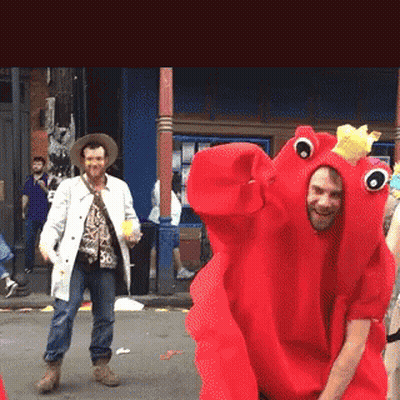 A Man In A Red Lobster Costume Is Dancing GIF