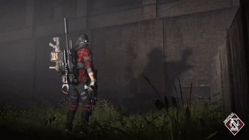 A Man In A Red Plaid Shirt Is Holding A Sniper Rifle In Front Of A Brick Wall GIF