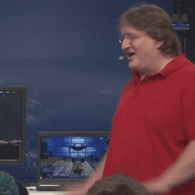 A Man In A Red Polo Shirt Is Standing In Front Of A Computer Screen GIF