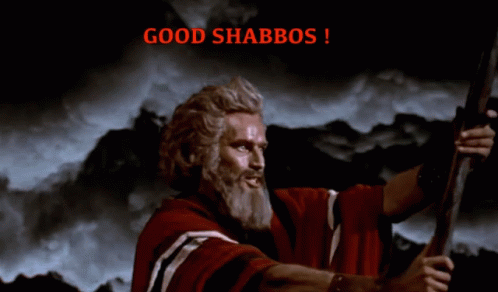 A Man In A Red Robe Is Holding A Sword And The Words Good Shabbos Are Above Him GIF