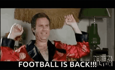 A Man In A Red Robe Is Raising His Fist In The Air While Wearing A Red Robe . GIF