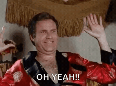 A Man In A Red Robe Is Waving His Hands And Saying `` Oh Yeah '' . GIF